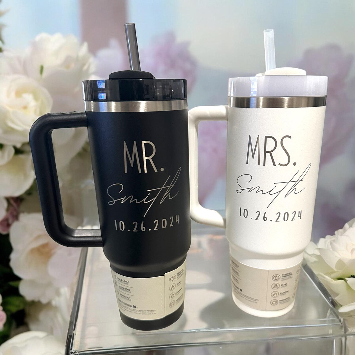 A pair of Stanley tumblers engraved as a Mr. and Mrs. wedding gift