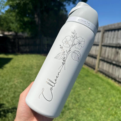 Personalized birth flower Owala FreeSip water bottle engraved with a name