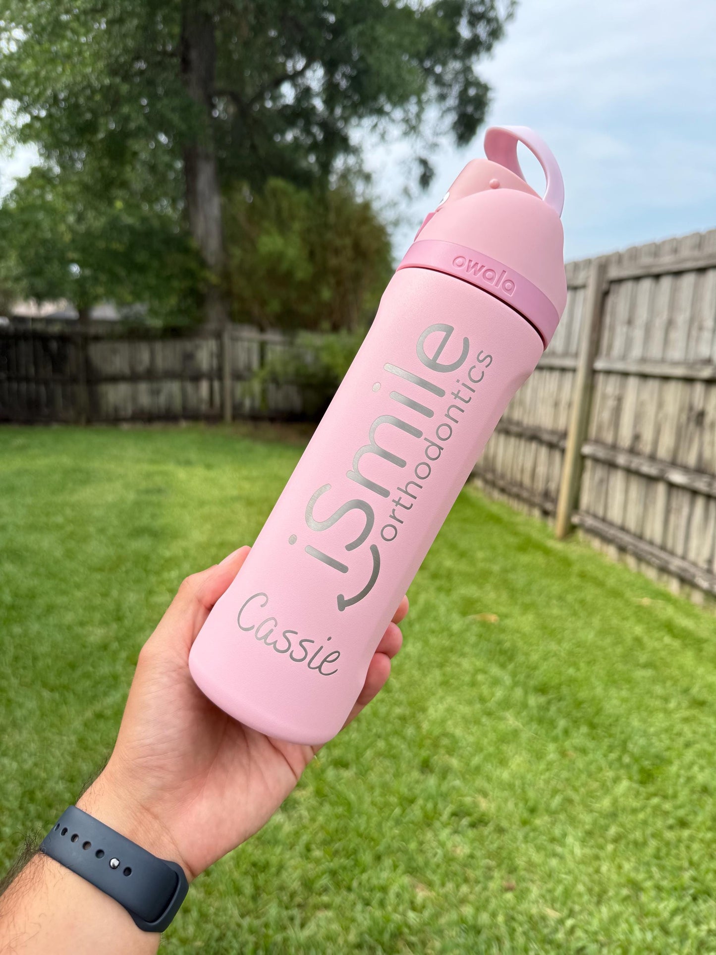 Engraved Owala FreeSip bottle with a practice logo and a name