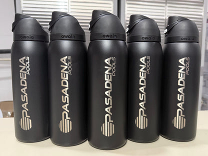 Company logo engraved on black Owala FreeSip bottles