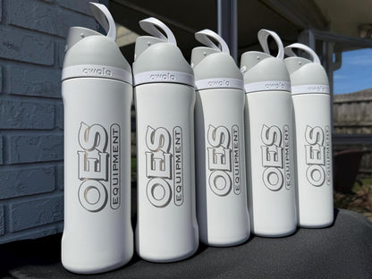 Company logo engraved on grey Owala FreeSip bottles