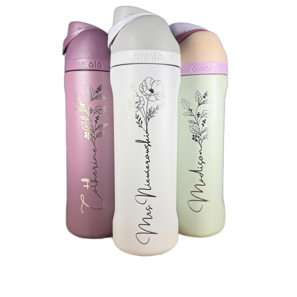 Pink, white and pale green Owala bottles with floral and personalized name engravings